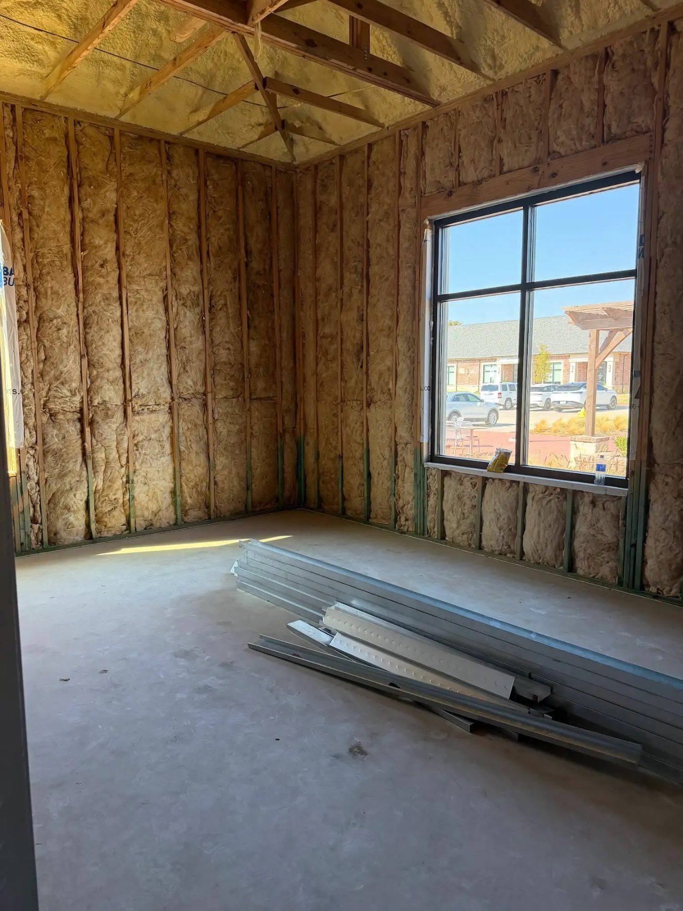 Future conference room of the Aleaf Insurance office in Frisco, TX, insulated and awaiting drywall