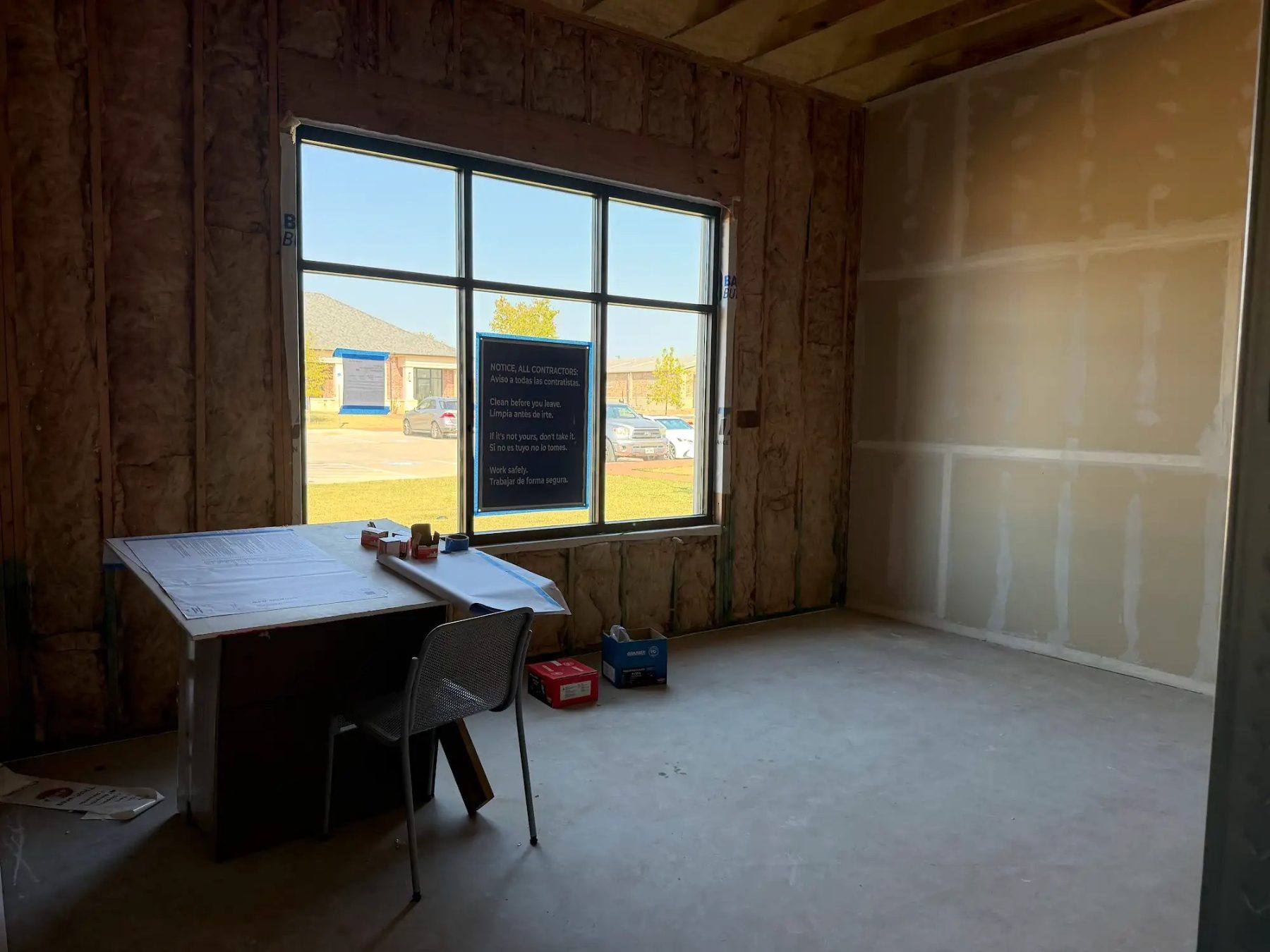 The owner's office at the Aleaf Insurance build-out in Frisco, TX, insulated with drywall started