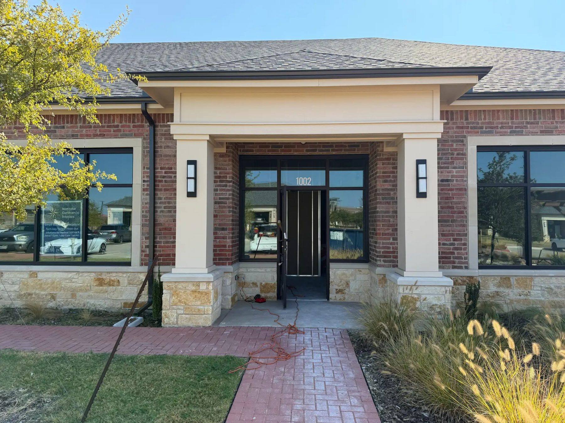 Brick and stone office building in Frisco, TX where NorthStar is building out a new office for Aleaf Insurance