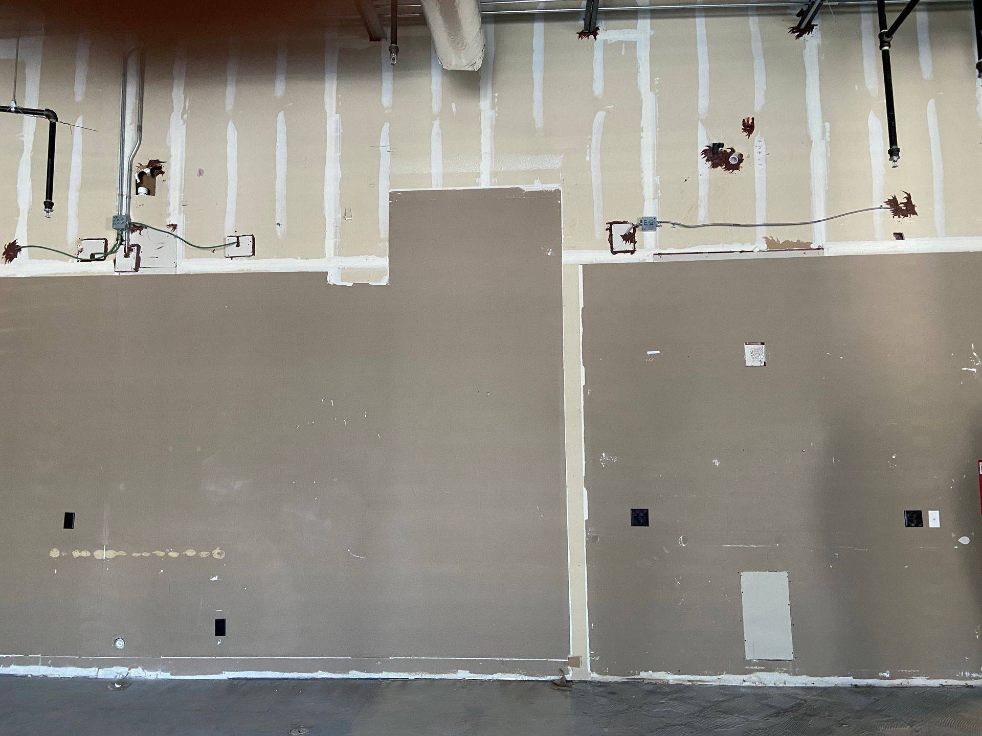 Before: the back wall of the former dental office that became Rockstar Martial Arts in Frisco, TX