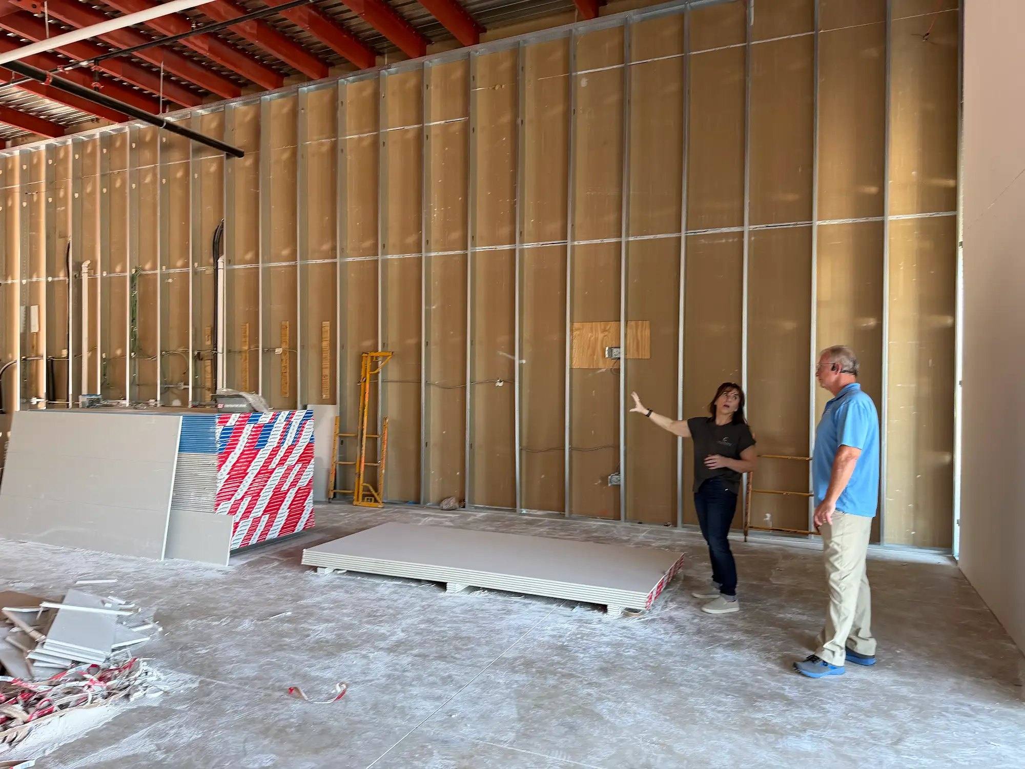 Walking the bare shell space of Calibrate Pilates Studio in McKinney, TX before construction began