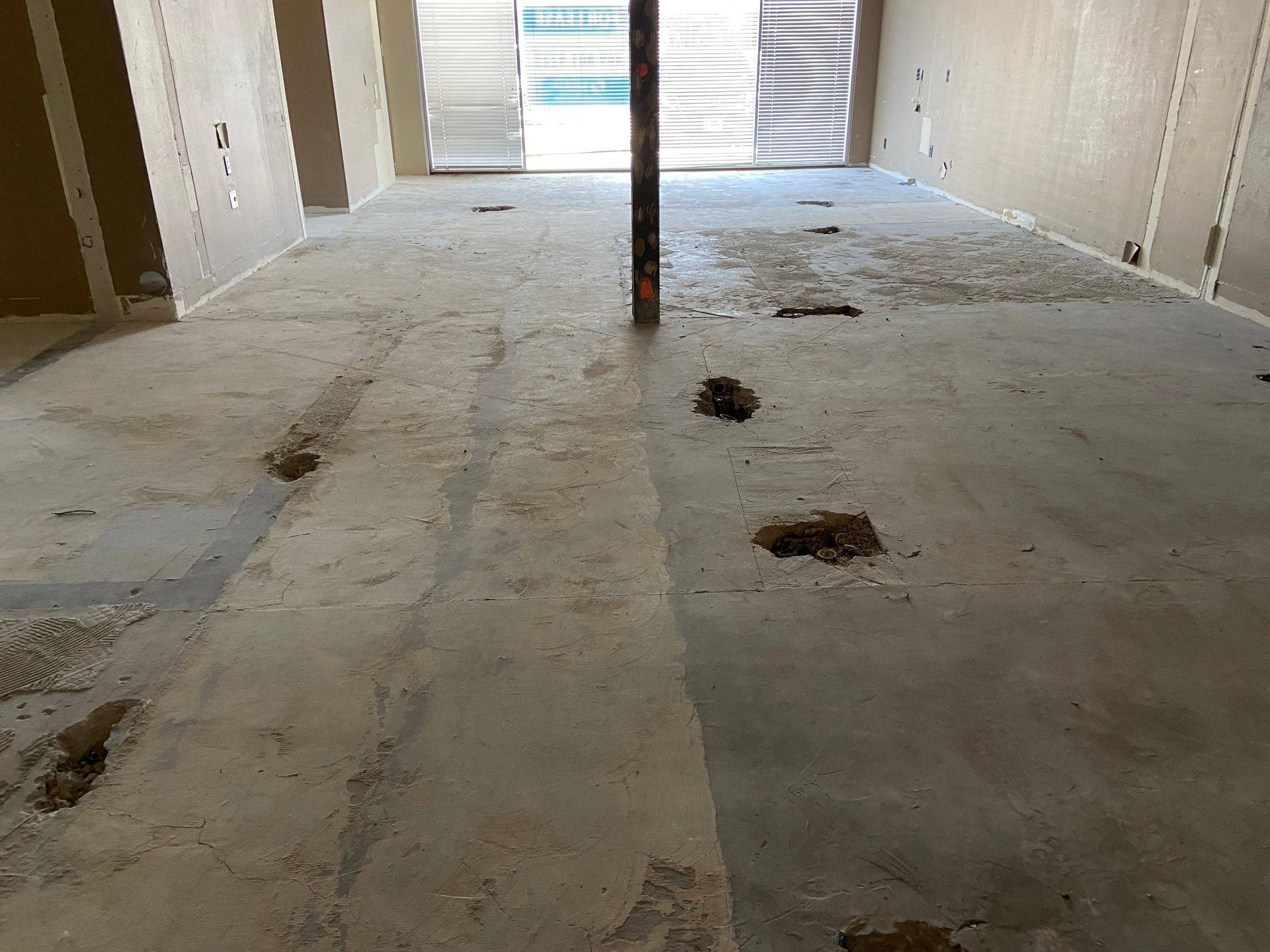 Before: the east side floors at the former dental office that became Rockstar Martial Arts in Frisco, TX