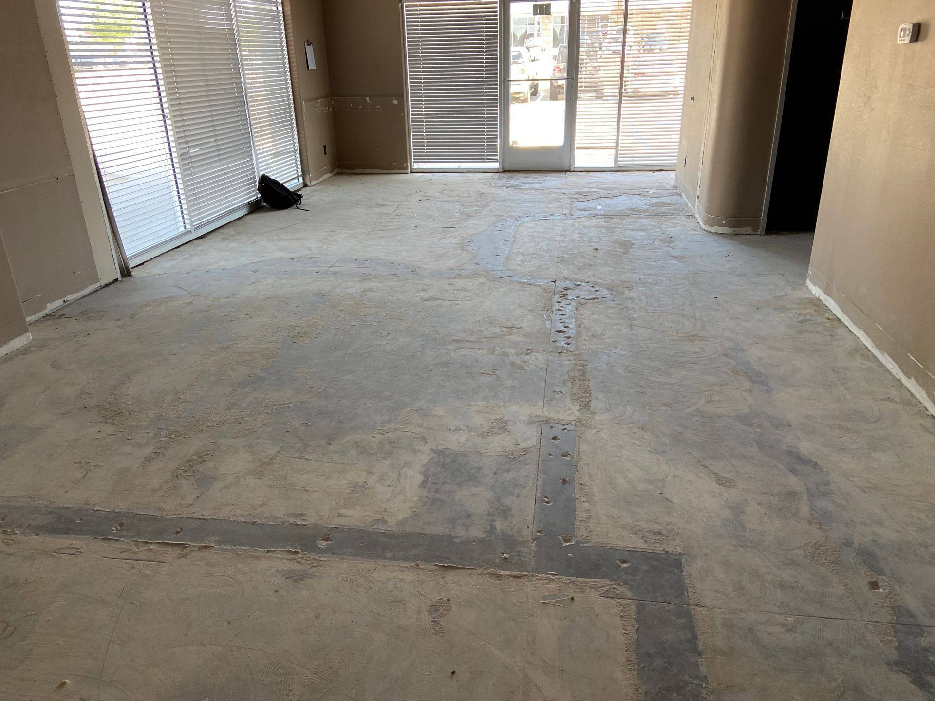 Before: the west side floors at the former dental office that became Rockstar Martial Arts in Frisco, TX