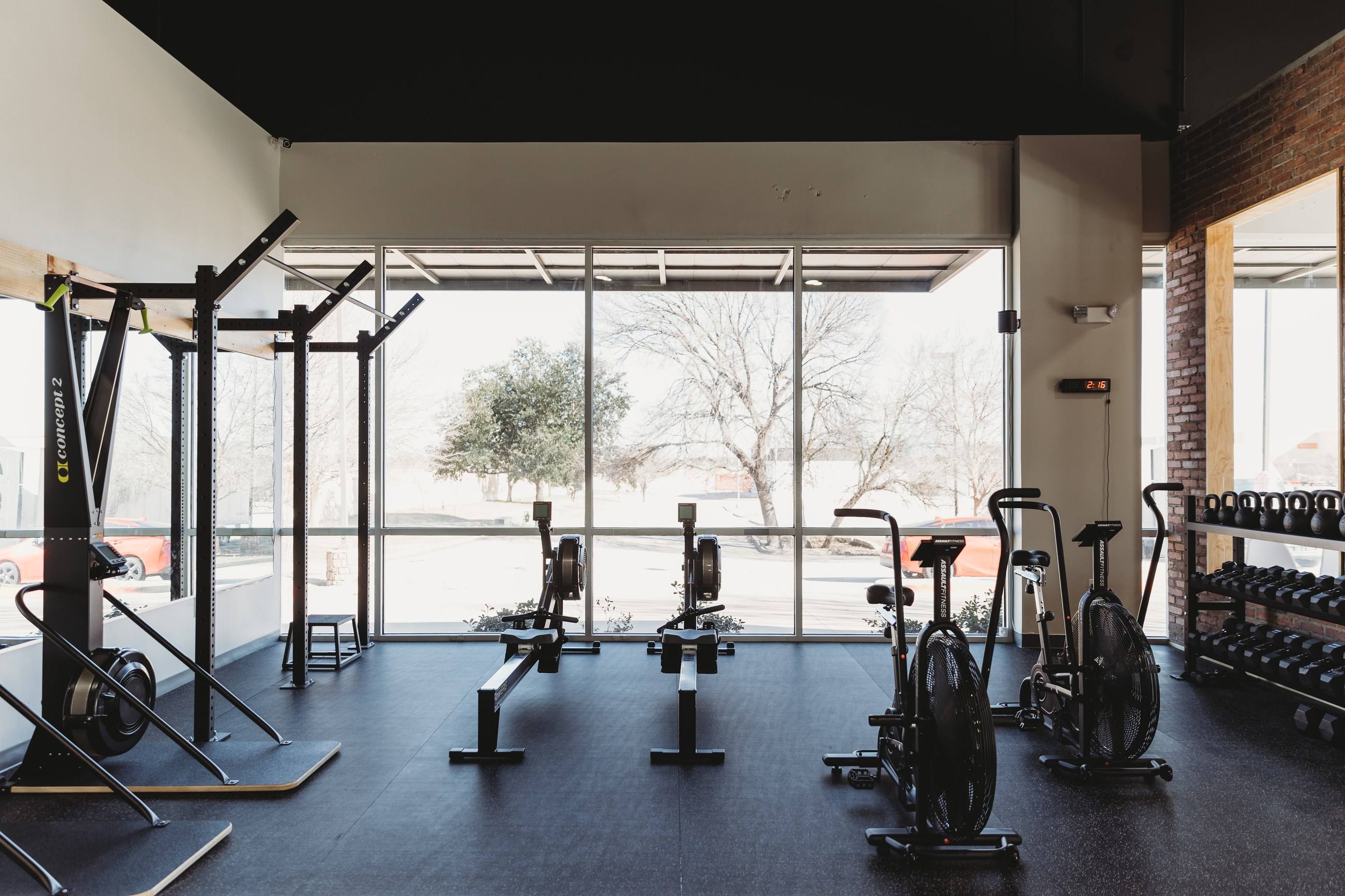 Completed fitness floor with full-height storefront glazing at Kung Fu Academy of North Texas in McKinney, TX