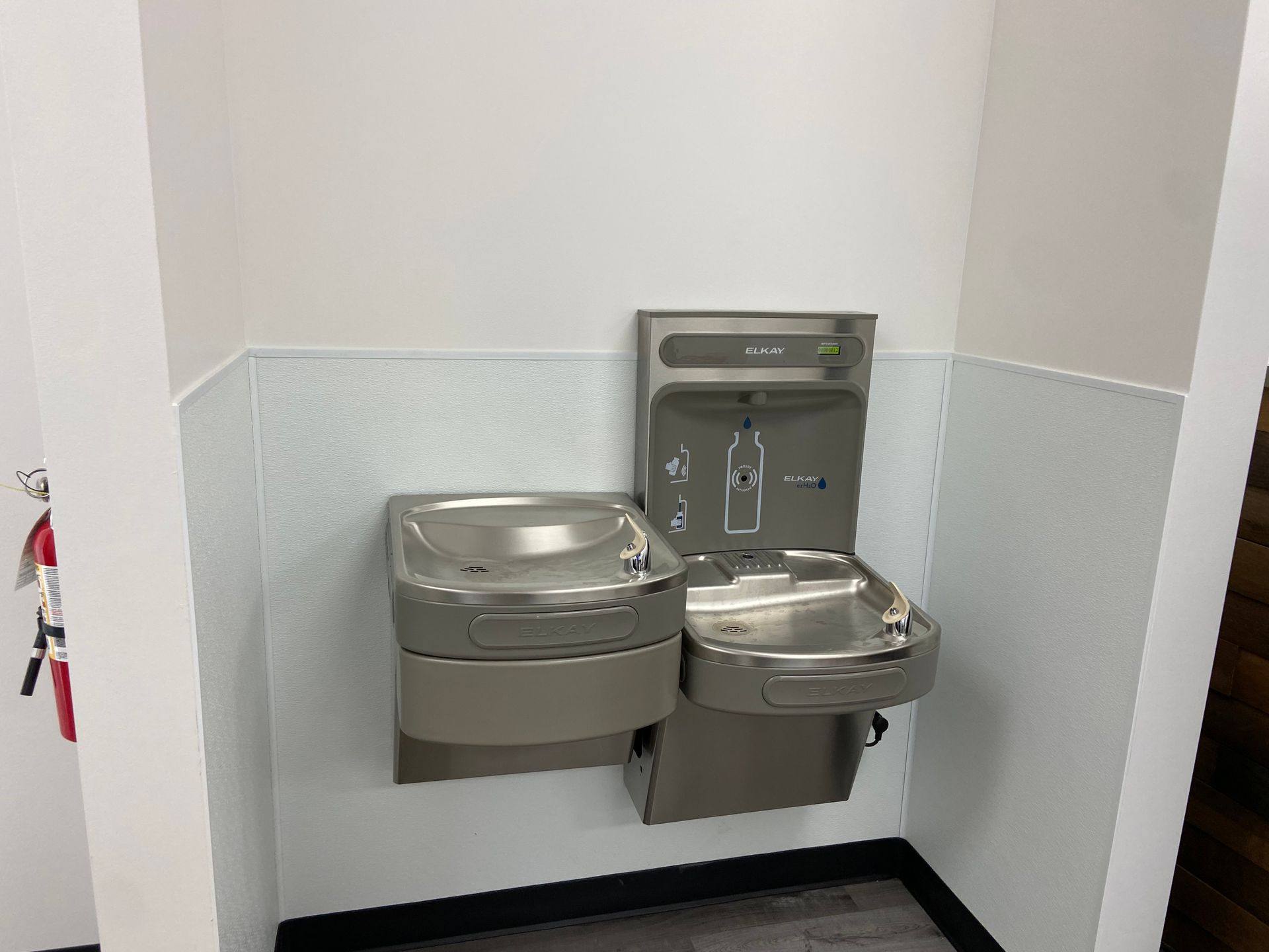 The finished bi-level drinking fountain and bottle filler at Professional Black Belt Academy in Celina, TX