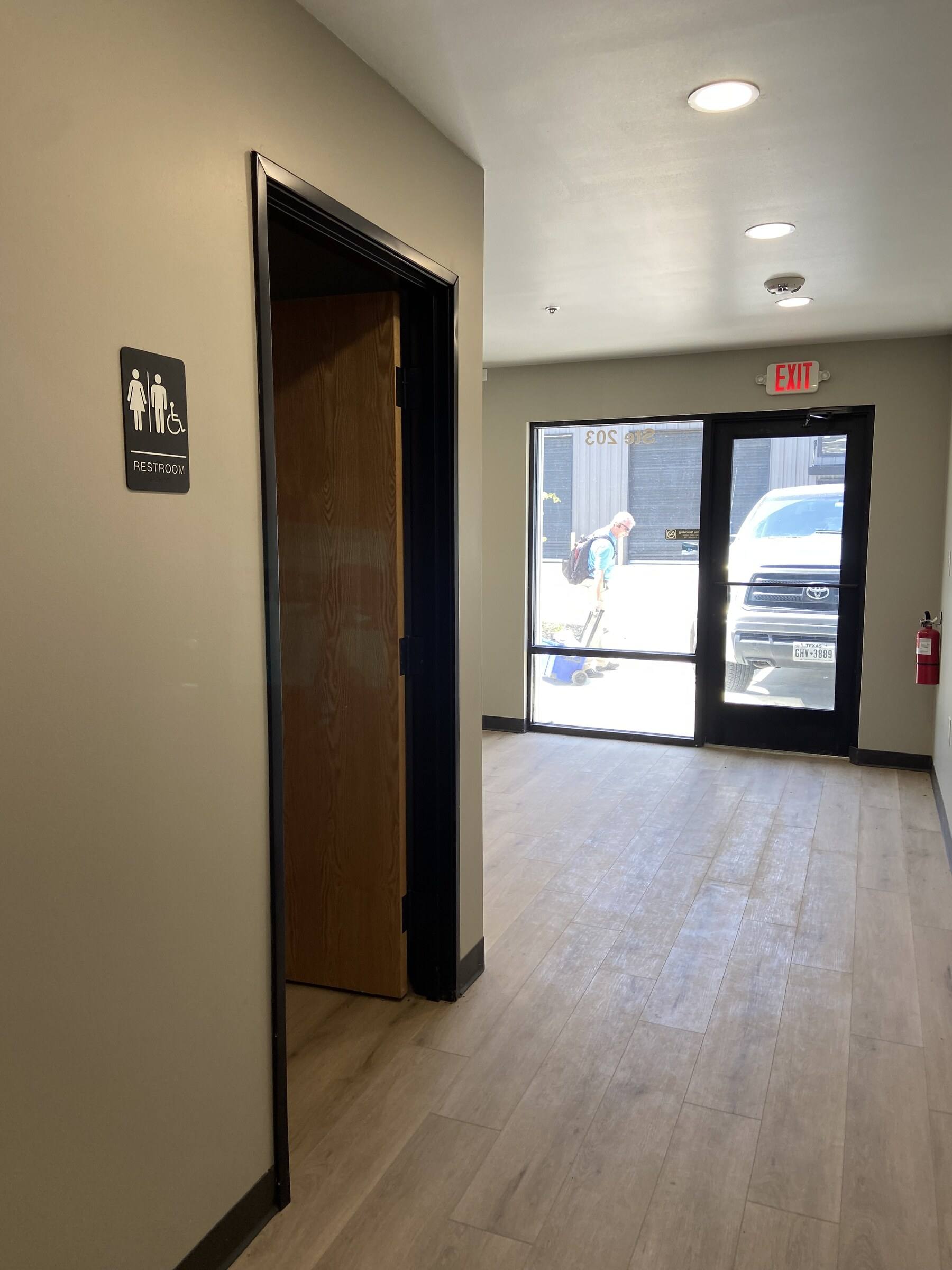 Finished corridor and entrance at the NSV Auto office finish-out in McKinney, TX