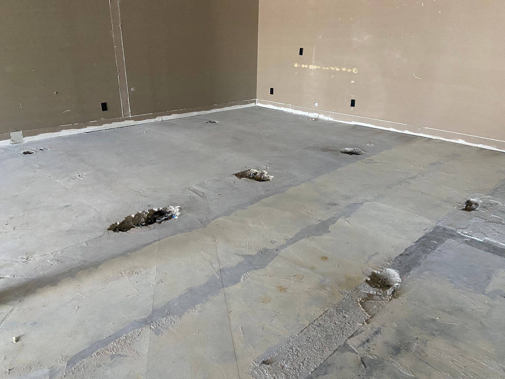 Before: holes in the back wall of the former dental office that became Rockstar Martial Arts in Frisco, TX