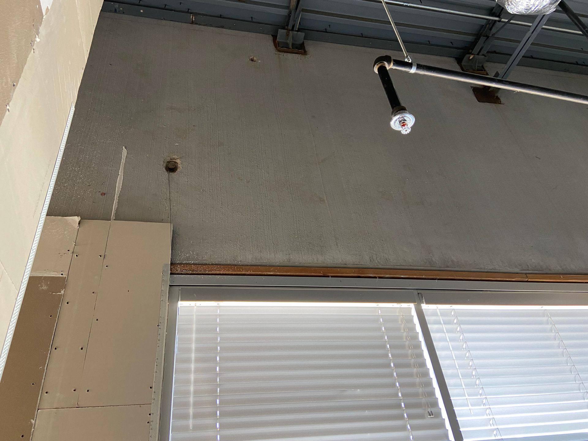 Before: holes in the wall of the former dental office that became Rockstar Martial Arts in Frisco, TX
