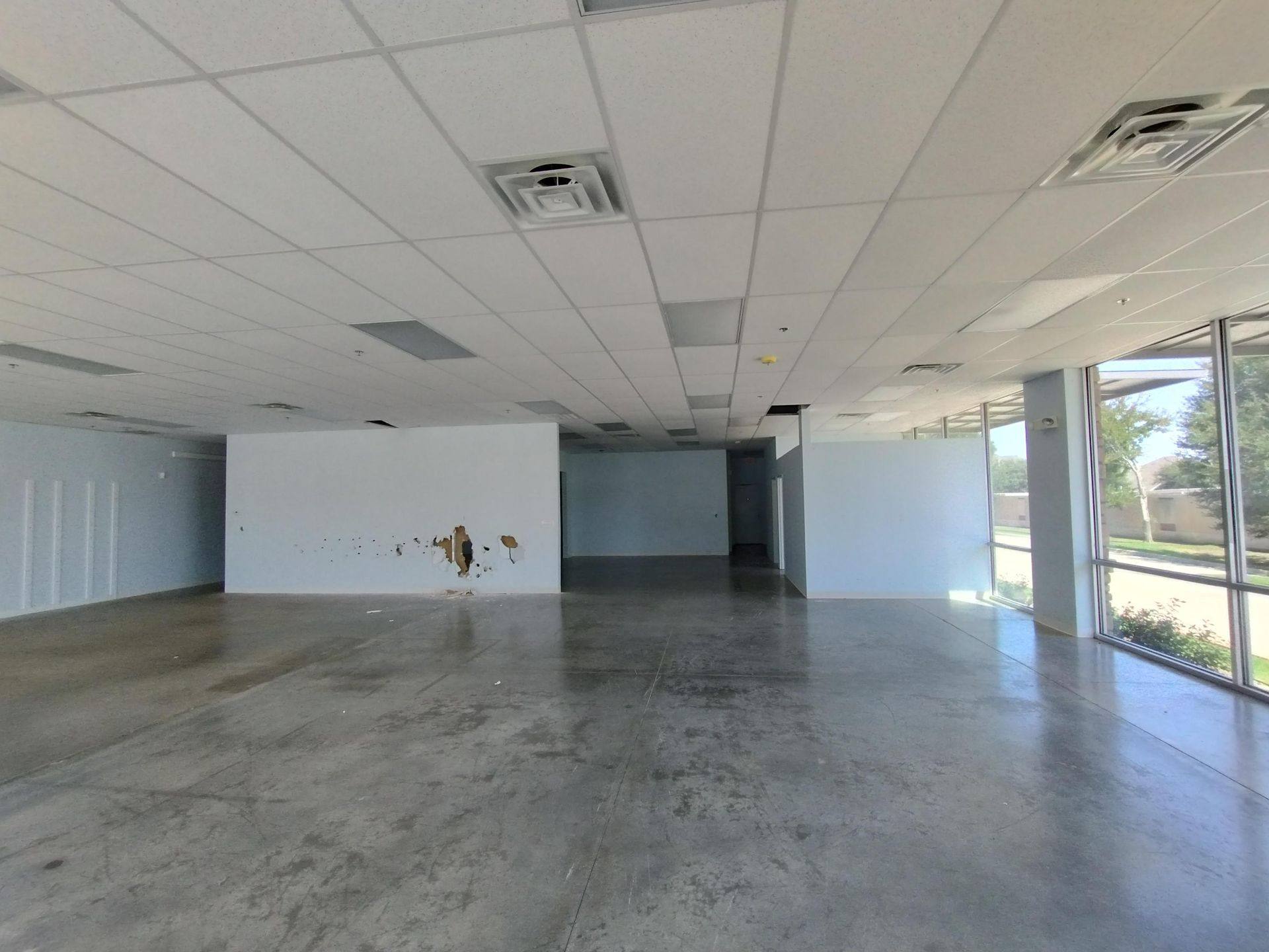 Before: the retail space that became Kung Fu Academy of North Texas in McKinney, TX, seen from the east side
