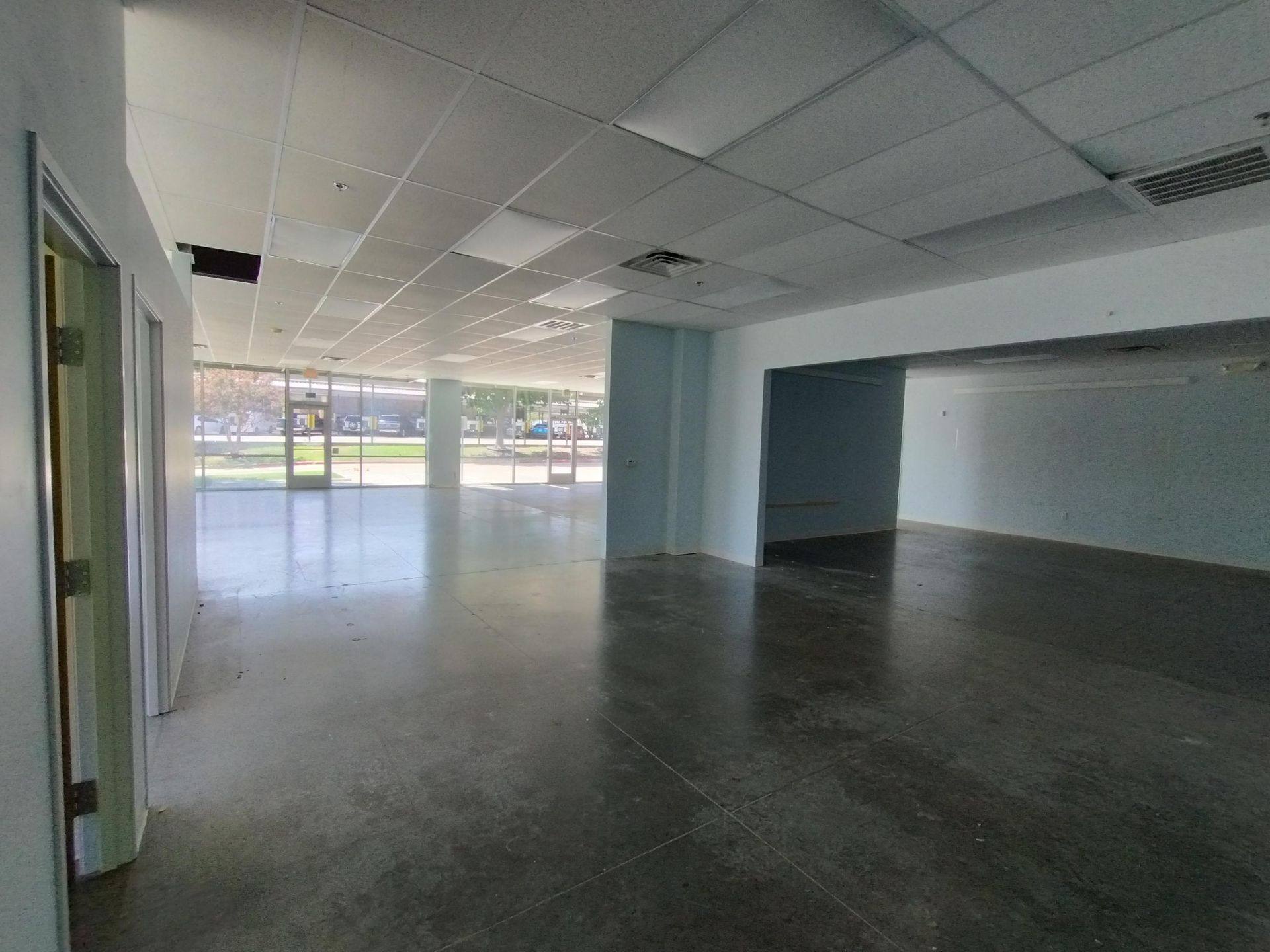 Before: the retail space that became Kung Fu Academy of North Texas in McKinney, TX, seen from the back