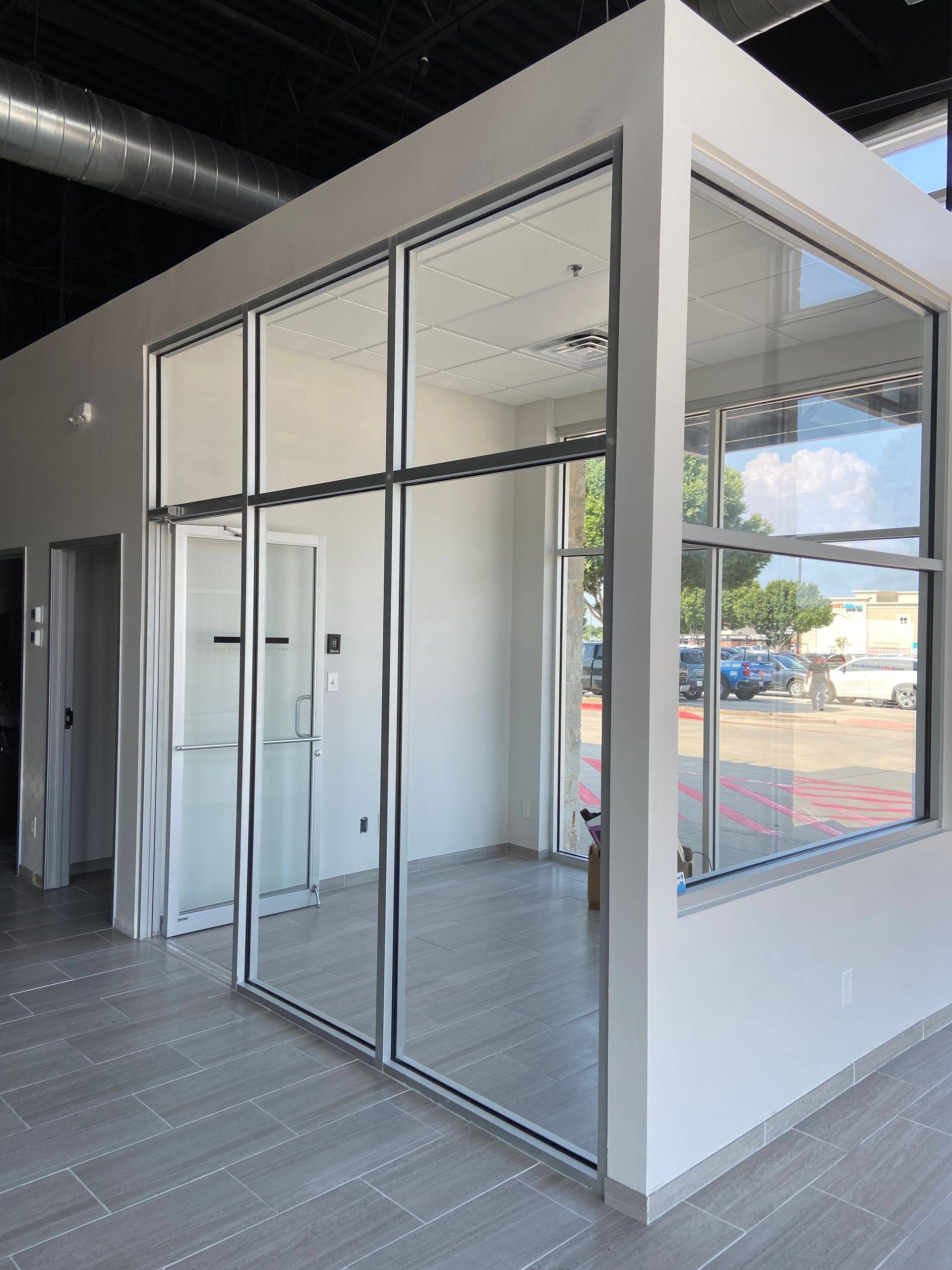 Progress: glass installed for the office during the Rockstar Martial Arts remodel in Frisco, TX