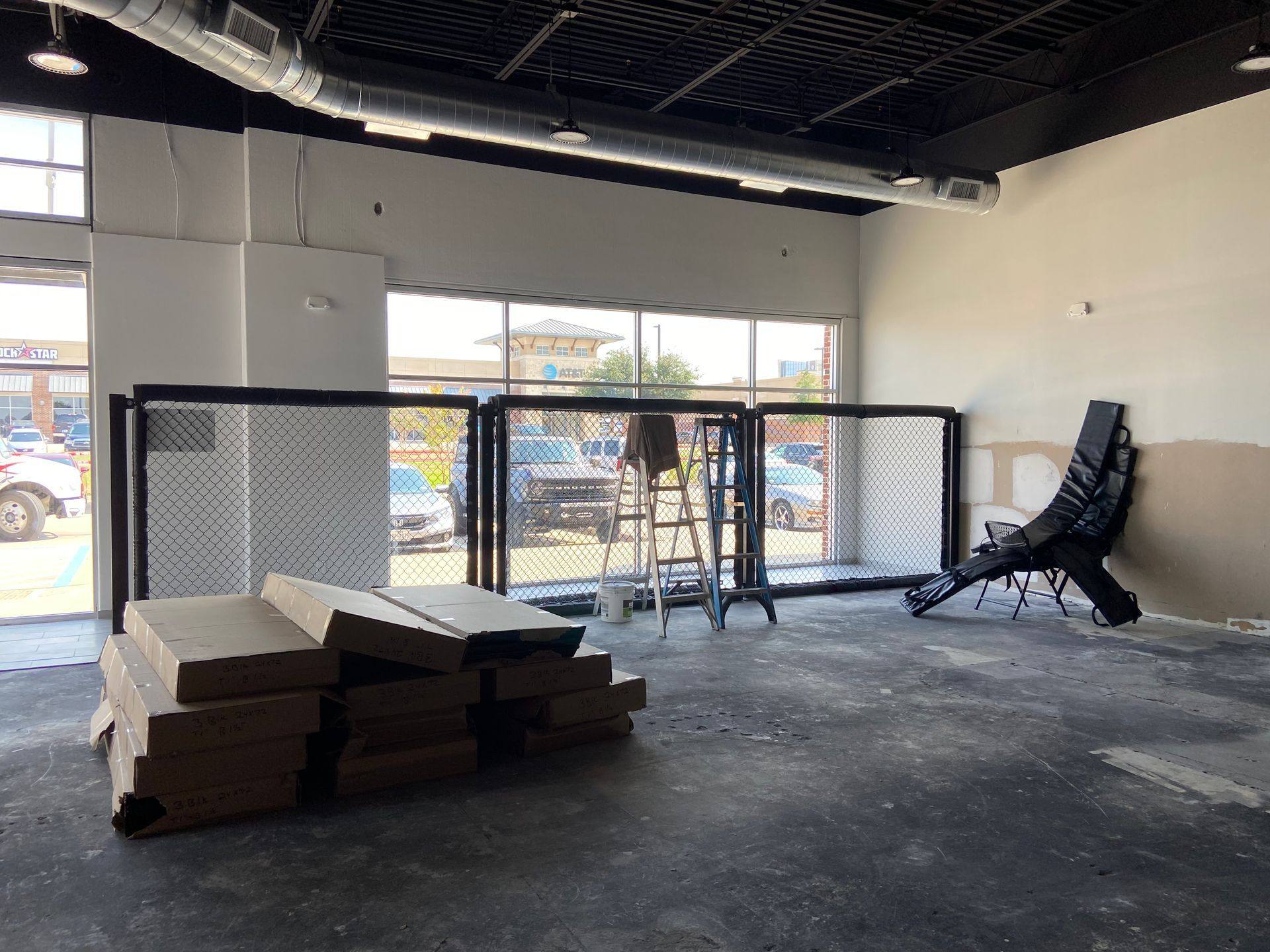 Progress: fencing and tile installation during the Rockstar Martial Arts remodel in Frisco, TX