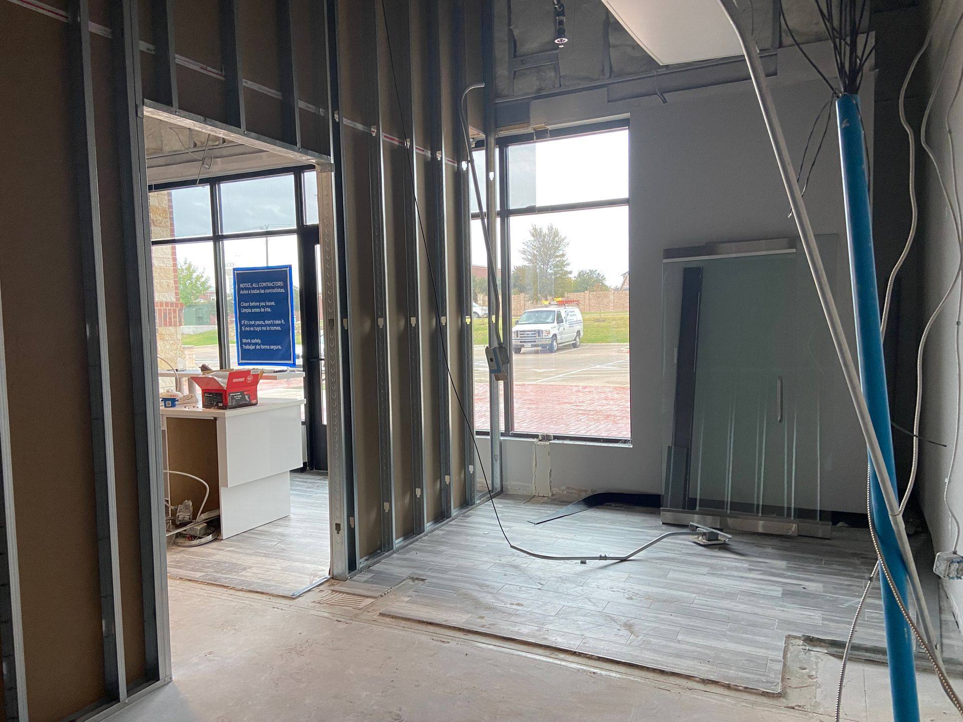 A new wall framed during the Augment Wellness remodel in Frisco, TX