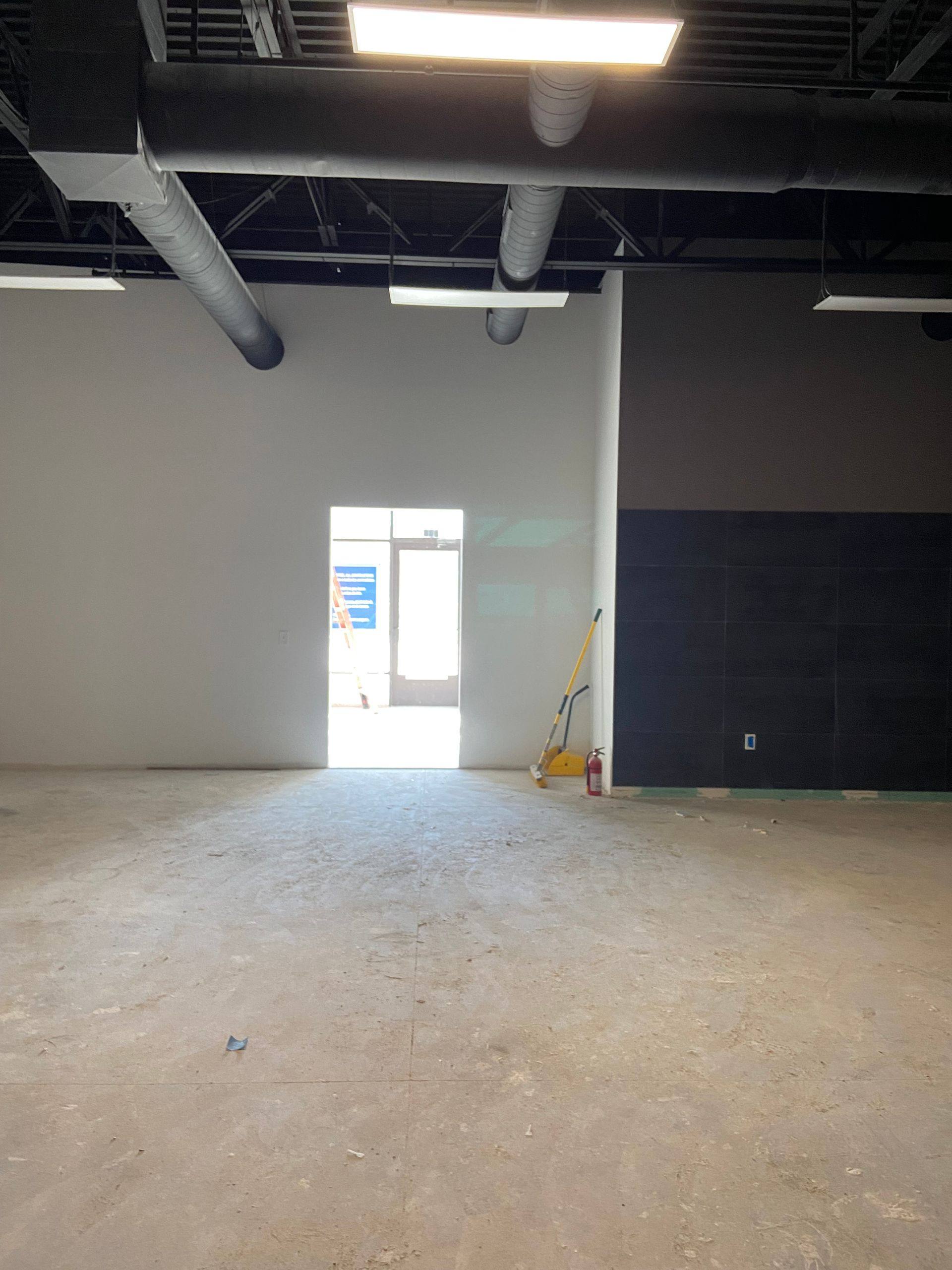 New walls and tile added during the Augment Wellness remodel in Frisco, TX