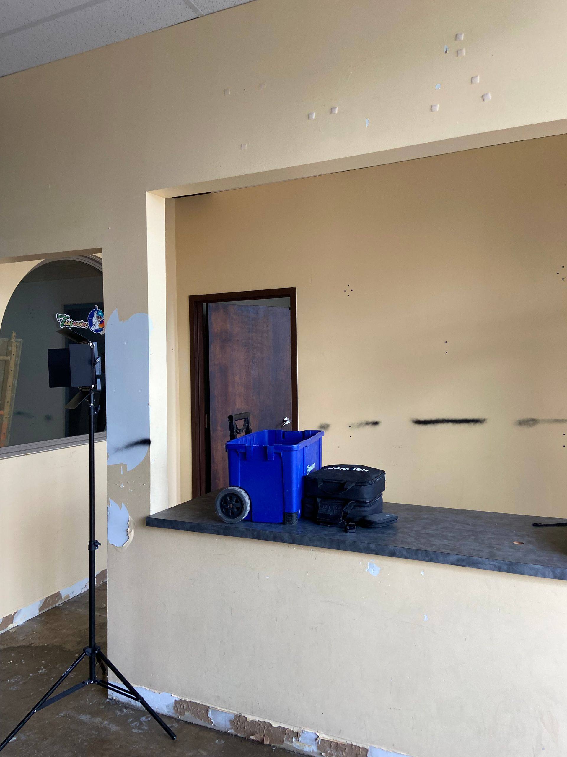 Before: the entry of the former martial arts studio that became The Back Nine Golf in Denton, TX