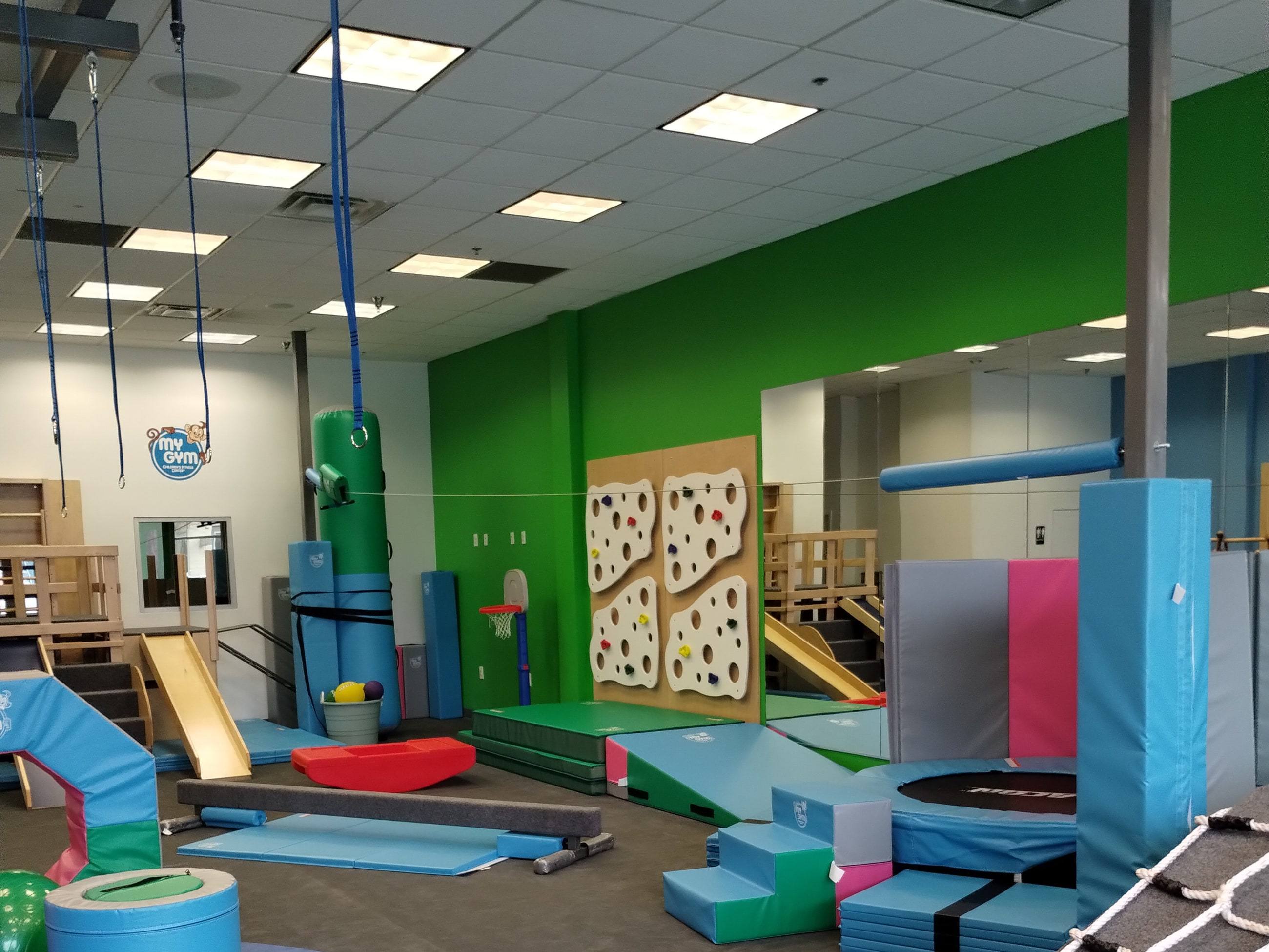 Play structure and climbing wall at My Gym in Allen, TX after a second-generation remodel