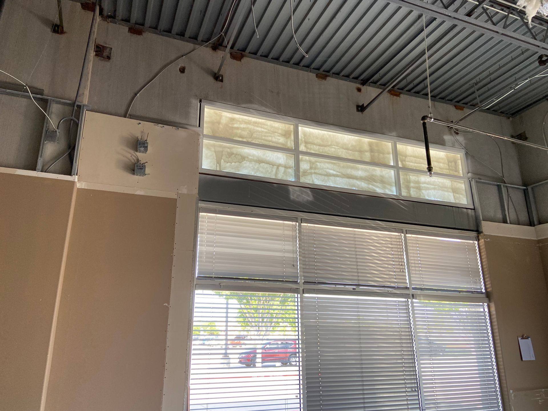 Before: painted-over windows at the former dental office that became Rockstar Martial Arts in Frisco, TX