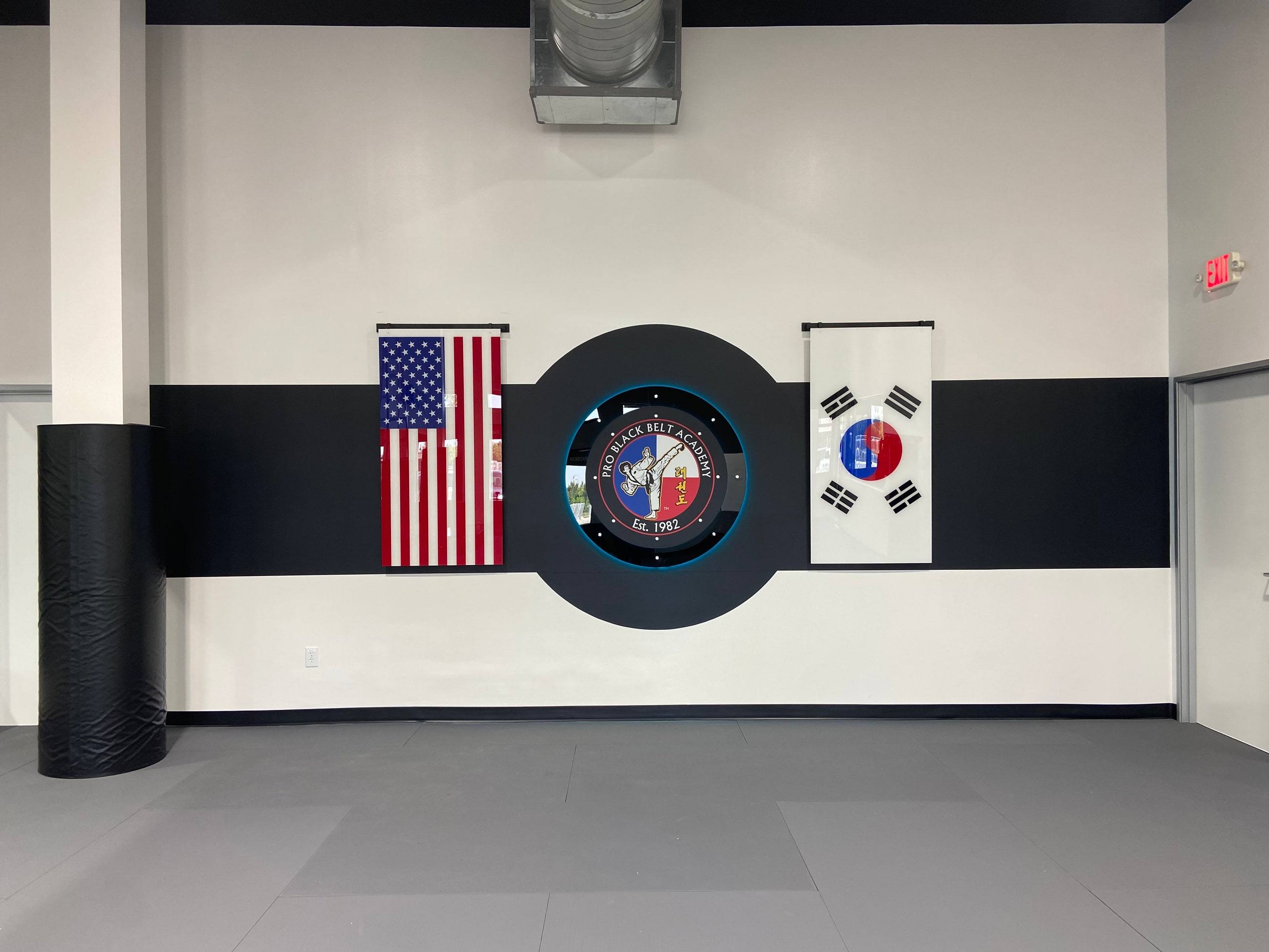 Finished feature wall and mat flooring at Professional Black Belt Academy in Celina, TX