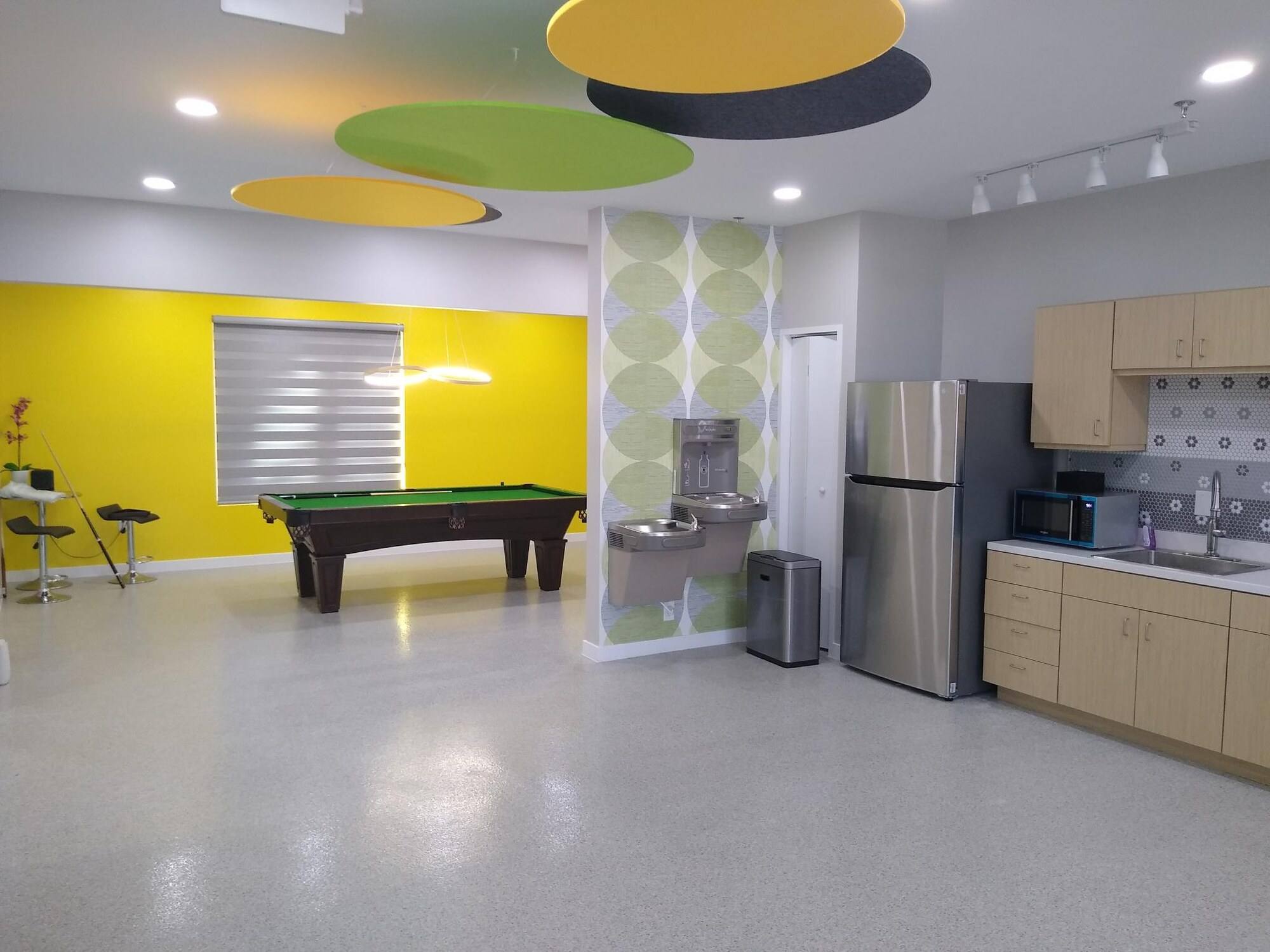 Finished break area, kitchenette and games space at Vzure Solutions in Frisco, TX