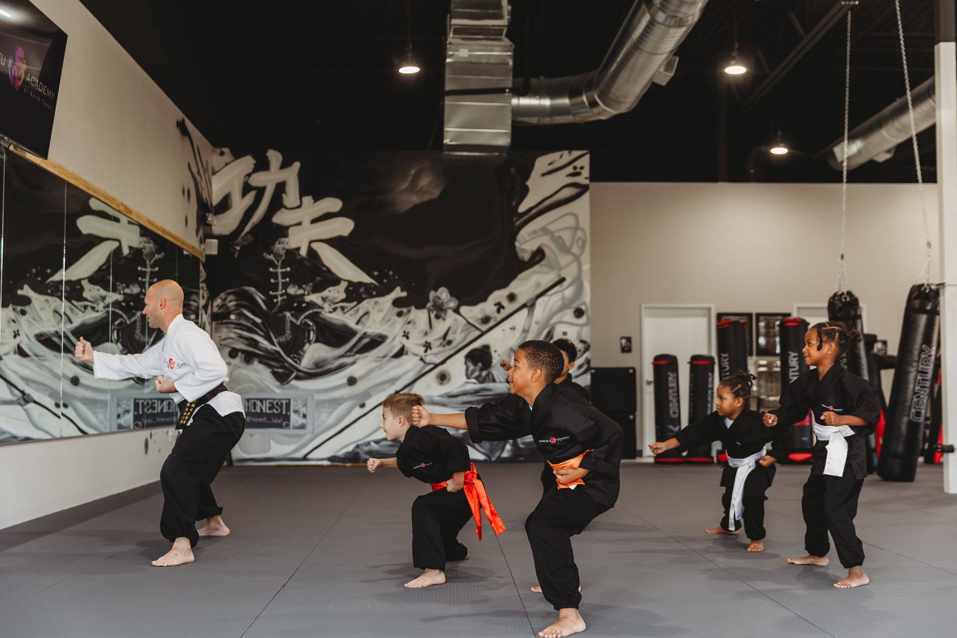 After: a children’s class training in front of the mural at Kung Fu Academy of North Texas in McKinney, TX